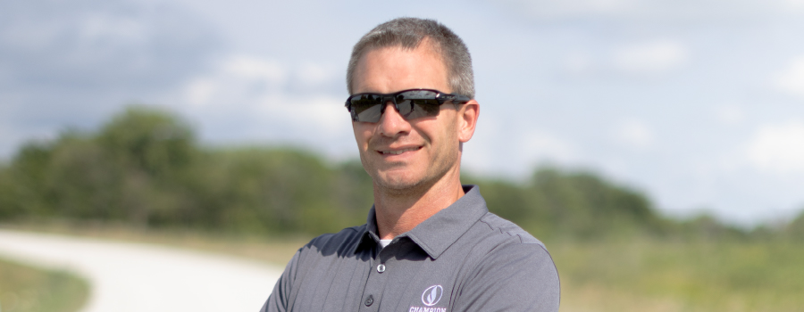 Headshot of Chad Hustedt wearing a Champion Seed polo